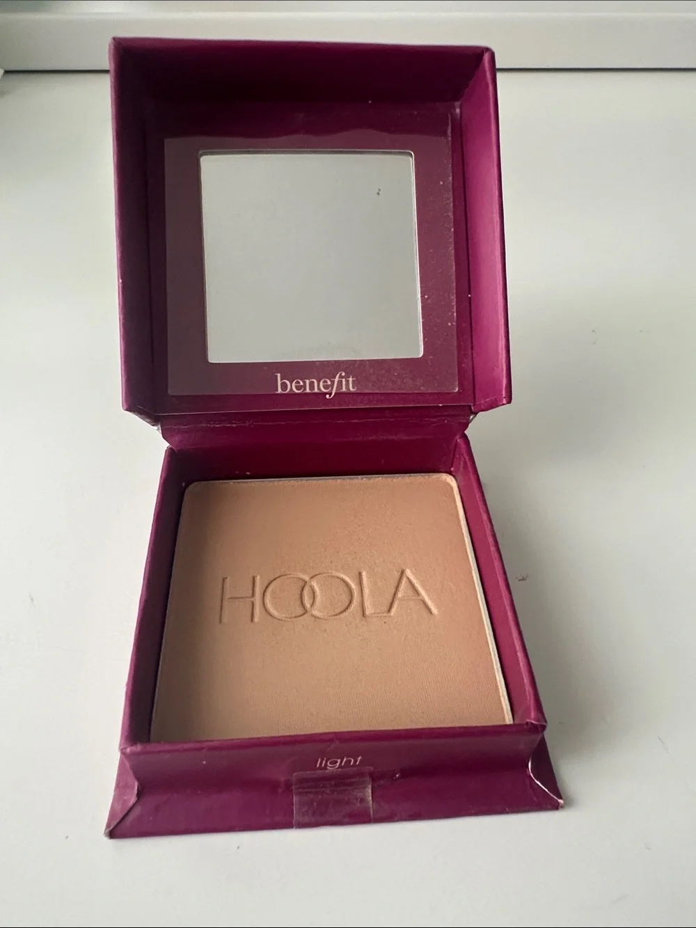 Benefit Hoola Light Bronzer - Plum Packaging with White Floral Accent